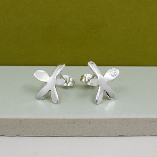 These exquisite Móinéir - Small Silver Happy Daisy Earrings - Stud are 17 MM in length and 14 MM in width (equivalent to 11/16 inches by 9/16 inches). Made with .950 sterling silver, these earrings feature a high polished silver finish and friction post.