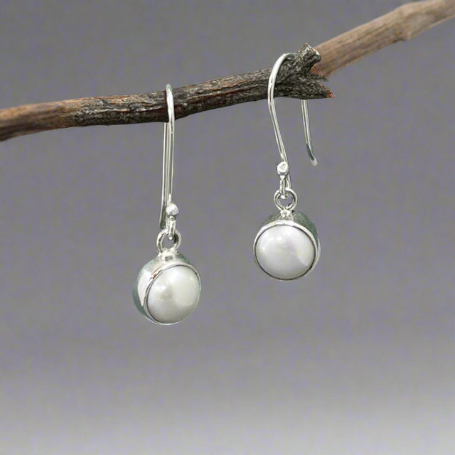 Pearla - Mounted White Pearl Silver Earrings - Dangle Curated and designed by Emilio Sotelo Jewelry for Croi Kinsale Jewellery in Kinsale West Cork Ireland Europe. Find exceptional handmade silver and gold jewellery at affordable prices for birthday gifts and Christmas presents. Handcrafted Silver jewelry. Find the best affordable jewellery