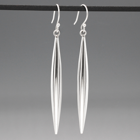 Add a touch of sophistication to your look with the Selene - Long LIT Silver Earrings. These elegant dangle earrings feature a sleek, tapered design that catches the light beautifully. Selene - Long LIT Silver Earrings - Dangle. 