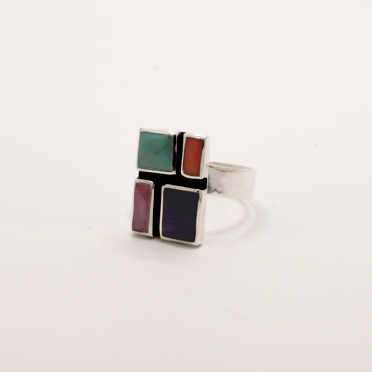 Sleveen's Rectangle With Multi-Coloured Mosaic Resin Adjustable Silver Ring is 13mm wide, 18mm long, 3mm deep, and 5mm wide on the silver band. Easily adjusted to fit sizes 7-10, this .925 silver piece is inspired by the vibrant hues of Kinsale's homes.