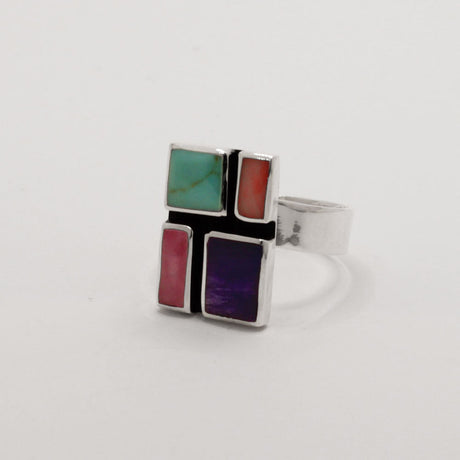 Sleveen's Rectangle With Multi-Coloured Mosaic Resin Adjustable Silver Ring is 13mm wide, 18mm long, 3mm deep, and 5mm wide on the silver band. Easily adjusted to fit sizes 7-10, this .925 silver piece is inspired by the vibrant hues of Kinsale's homes.