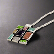 Sleveen's Square with Multi-Coloured Mosaic Resin Silver Pendant is a striking and vibrant piece, perfect for adding a splash of colour to your jewellery collection. Inspired by the colourful houses of Kinsale, this pendant features a bold square design with beautiful mosaic resin inlays that capture the town's vibrant charm. Ireland silver jewellery. Sleveen Square-With-Multi-Coloured-Mosaic-Resin-Pendant__Ireland_jewellery