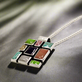 Sleveen's Square with Multi-Coloured Mosaic Resin Silver Pendant is a striking and vibrant piece, perfect for adding a splash of colour to your jewellery collection. Inspired by the colourful houses of Kinsale, this pendant features a bold square design with beautiful mosaic resin inlays that capture the town's vibrant charm. Ireland silver jewellery. Sleveen Square-With-Multi-Coloured-Mosaic-Resin-Pendant__Ireland_jewellery