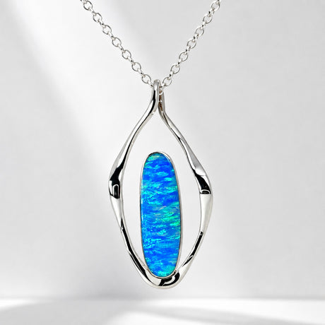 Tara Blue Opalescent Oblong in Flame-Shaped Framed Silver Pendant