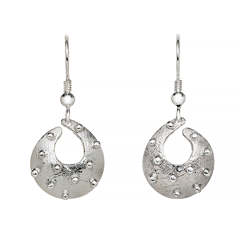Cloicin, from the Irish for small stone, was his very first collection and still one of his best selling today. Inspired by the stony shoreline of Carlingford Lough the collection features an etched surface representing the sandy surface that all the stones and pebbles lie on. These delicate earrings are ideal for everyday wear.