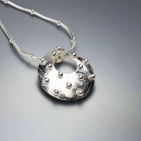 Cloicin Torc Medium Silver Pendant,Ê Shop affordable, high-quality jewellery in Kinsale, West Cork, Ireland designed by Emilio Sotelo Jewelry