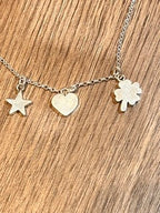 EIRE - Small Irish Heart + Shamrock + Star Silver Charm Set Pendant Curated and designed by Emilio Sotelo Jewelry for Croi Kinsale Jewellery in Kinsale West Cork Ireland Europe. Find exceptional handmade silver and gold jewellery at affordable prices for birthday gifts and Christmas presents. Find Irish designers and makers. Beautiful jewellery shop located in Kinsale, Co. Cork.