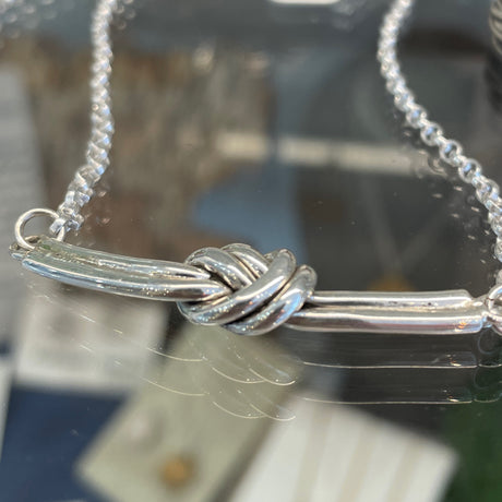 Aran - Double Knot Silver Necklace Curated and designed by Emilio Sotelo Jewelry for Croi Kinsale Jewellery in Kinsale West Cork Ireland Europe. Find exceptional handmade silver and gold jewellery at affordable prices for birthday gifts and Christmas presents. Handcrafted Silver jewelry. Find the best affordable jewellery