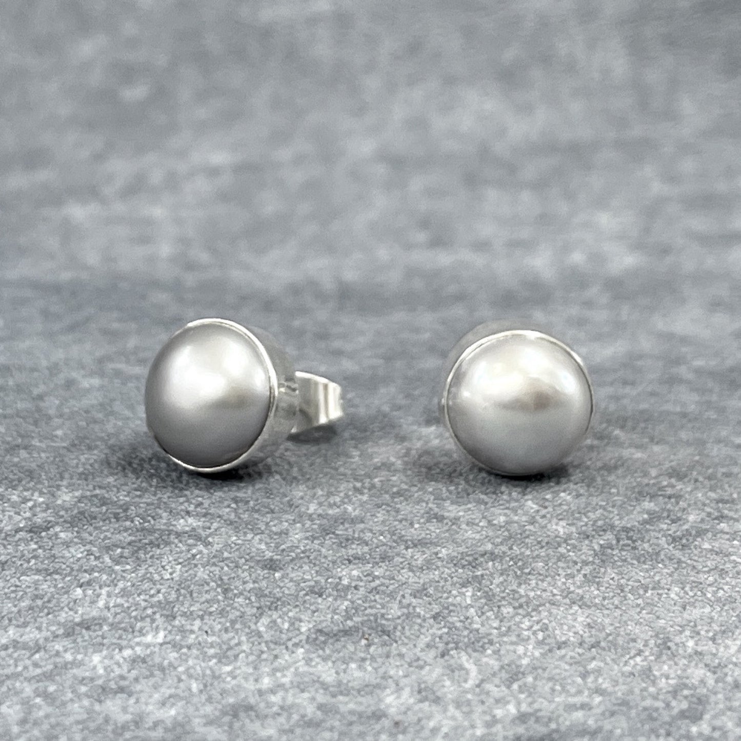 Pearla - Mounted Gray Pearl Silver Earrings - Stud Curated and designed by Emilio Sotelo Jewelry for Croi Kinsale Jewellery in Kinsale West Cork Ireland Europe. Find exceptional handmade silver and gold jewellery at affordable prices for birthday gifts and Christmas presents. Handcrafted Silver jewelry. Find the best affordable jewellery