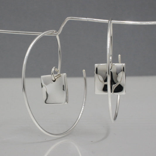 Selene - Small Square Reverse Hoop Silver Earrings Curated and designed by Emilio Sotelo Jewelry for Croi Kinsale Jewellery in Kinsale West Cork Ireland Europe. Find exceptional handmade silver and gold jewellery at affordable prices for birthday gifts and Christmas presents. Handcrafted Silver jewelry. The best affordable jewellery