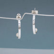 Artemis - Small Half Hoop Pearl Silver Earrings - Stud Curated and designed by Emilio Sotelo Jewelry for Croi Kinsale Jewellery in Kinsale West Cork Ireland Europe. Find exceptional handmade silver and gold jewellery at affordable prices for birthday gifts and Christmas presents. Handcrafted Silver jewelry. Find the best affordable jewellery