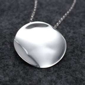 Selene - Disc Silver Pendant Curated and designed by Emilio Sotelo Jewelry for Croi Kinsale Jewellery in Kinsale West Cork Ireland Europe. Find exceptional handmade silver and gold jewellery at affordable prices for birthday gifts and Christmas presents. Find Irish designers and makers. Beautiful jewellery shop located in Kinsale, Co. Cork. With Bail On Back