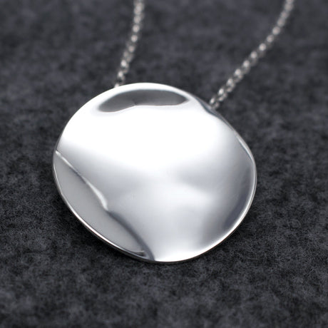 Selene - Disc Silver Pendant Curated and designed by Emilio Sotelo Jewelry for Croi Kinsale Jewellery in Kinsale West Cork Ireland Europe. Find exceptional handmade silver and gold jewellery at affordable prices for birthday gifts and Christmas presents. Find Irish designers and makers. Beautiful jewellery shop located in Kinsale, Co. Cork. With Bail On Back