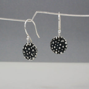 Firmament - Small Disc Oxidised Silver Earrings - Dangle Curated and designed by Emilio Sotelo Jewelry for Croi Kinsale Jewellery in Kinsale West Cork Ireland Europe. Find exceptional handmade silver and gold jewellery at affordable prices for birthday gifts and Christmas presents. Handcrafted Silver jewelry. Find the best affordable jewellery