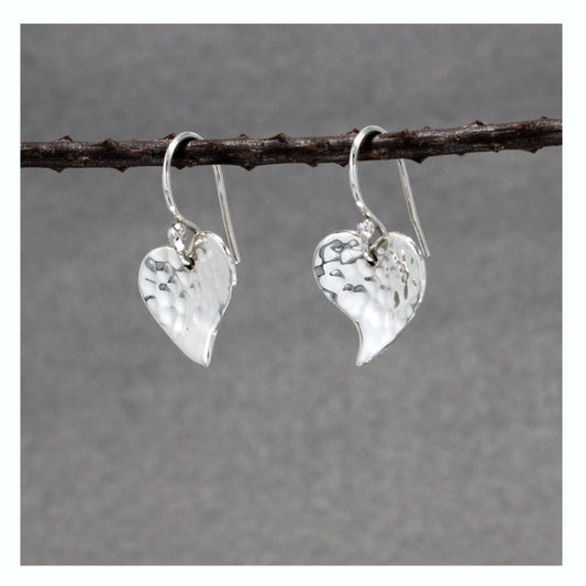 Croi - Small Heart Hammered Silver Earrings - Dangle Curated and designed by Emilio Sotelo Jewelry for Croi Kinsale Jewellery in Kinsale West Cork Ireland Europe. Find exceptional handmade silver and gold jewellery at affordable prices for birthday gifts and Christmas presents. Handcrafted Silver jewelry. Find the best affordable jewellery