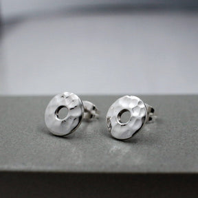 Artemis - Small Off-Center Disc Hammered Silver Earrings - Stud Curated and designed by Emilio Sotelo Jewelry for Croi Kinsale Jewellery in Kinsale West Cork Ireland Europe. Find exceptional handmade silver and gold jewellery at affordable prices for birthday gifts and Christmas presents. Handcrafted Silver jewelry. Find the best affordable jewellery