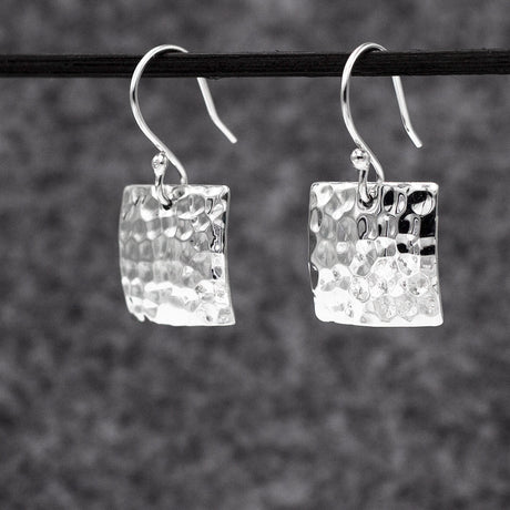 Artemis - Square Hammered Silver Earrings - Dangle Curated and designed by Emilio Sotelo Jewelry for Croi Kinsale Jewellery in Kinsale West Cork Ireland Europe. Find exceptional handmade silver and gold jewellery at affordable prices for birthday gifts and Christmas presents. Handcrafted Silver jewelry. Find the best affordable jewellery