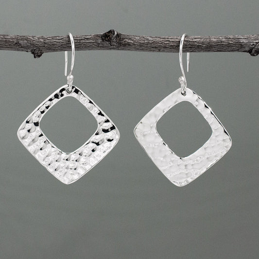 At 29mm x 29mm in size, featuring a 1 1/4 inch length and width, and a 1 11/16 inch drop from the ear wire, these Nathalia's Rhombus With Off-Center Hammered Silver Earrings - Dangle are made of .950 sterling silver with a stunning hammered finish. With sterling silver French wire.