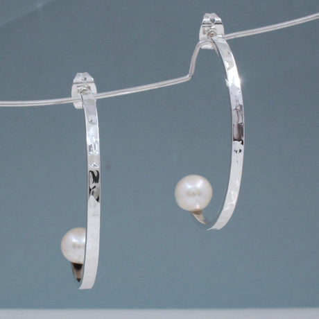 Artemis - Half Hoop Pearl Hammered Silver Earrings - Stud Curated and designed by Emilio Sotelo Jewelry for Croi Kinsale Jewellery in Kinsale West Cork Ireland Europe. Find exceptional handmade silver and gold jewellery at affordable prices for birthday gifts and Christmas presents. Handcrafted Silver jewelry. Find the best affordable jewellery