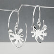 Moineir - Small Urban Flower Reverse Hoop Silver Earrings Curated and designed by Emilio Sotelo Jewelry for Croi Kinsale Jewellery in Kinsale West Cork Ireland Europe. Find exceptional handmade silver and gold jewellery at affordable prices for birthday gifts and Christmas presents. Handcrafted Silver jewelry. The best affordable jewellery
