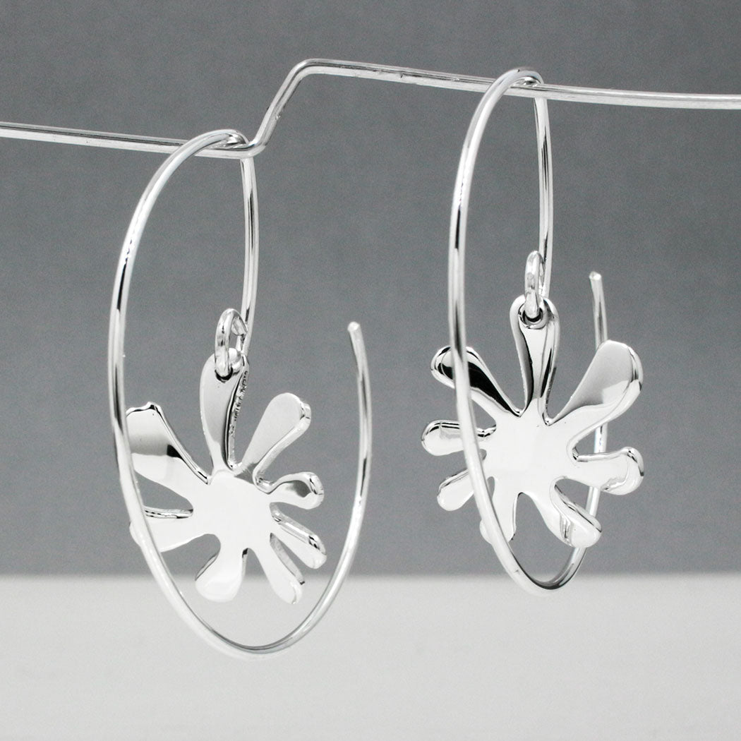 Moineir - Small Urban Flower Reverse Hoop Silver Earrings Curated and designed by Emilio Sotelo Jewelry for Croi Kinsale Jewellery in Kinsale West Cork Ireland Europe. Find exceptional handmade silver and gold jewellery at affordable prices for birthday gifts and Christmas presents. Handcrafted Silver jewelry. The best affordable jewellery