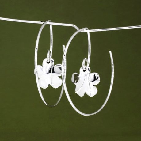 Moineir - Small Clover Reverse Hoop Silver Earrings Curated and designed by Emilio Sotelo Jewelry for Croi Kinsale Jewellery in Kinsale West Cork Ireland Europe. Find exceptional handmade silver and gold jewellery at affordable prices for birthday gifts and Christmas presents. Handcrafted Silver jewelry. The best affordable jewellery
