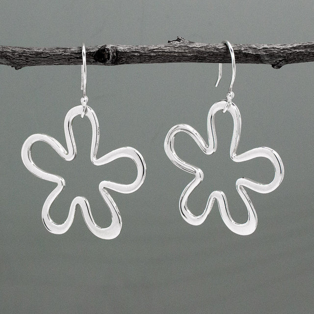 Moineir - Daisy Silhouette Silver Earrings - Dangle Curated and designed by Emilio Sotelo Jewelry for Croi Kinsale Jewellery in Kinsale West Cork Ireland Europe. Find exceptional handmade silver and gold jewellery at affordable prices for birthday gifts and Christmas presents. Handcrafted Silver jewelry. Find the best affordable jewellery