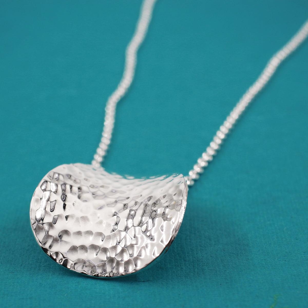 Móinéir Daisy Petal Hammered Silver Pendant,Ê Shop affordable, high-quality jewellery in Kinsale, West Cork, Ireland designed by