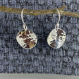 Selene - Disc Hammered Silver Earrings - Dangle Curated and designed by Emilio Sotelo Jewelry for Croi Kinsale Jewellery in Kinsale West Cork Ireland Europe. Find exceptional handmade silver and gold jewellery at affordable prices for birthday gifts and Christmas presents. Handcrafted Silver jewelry. Find the best affordable jewellery